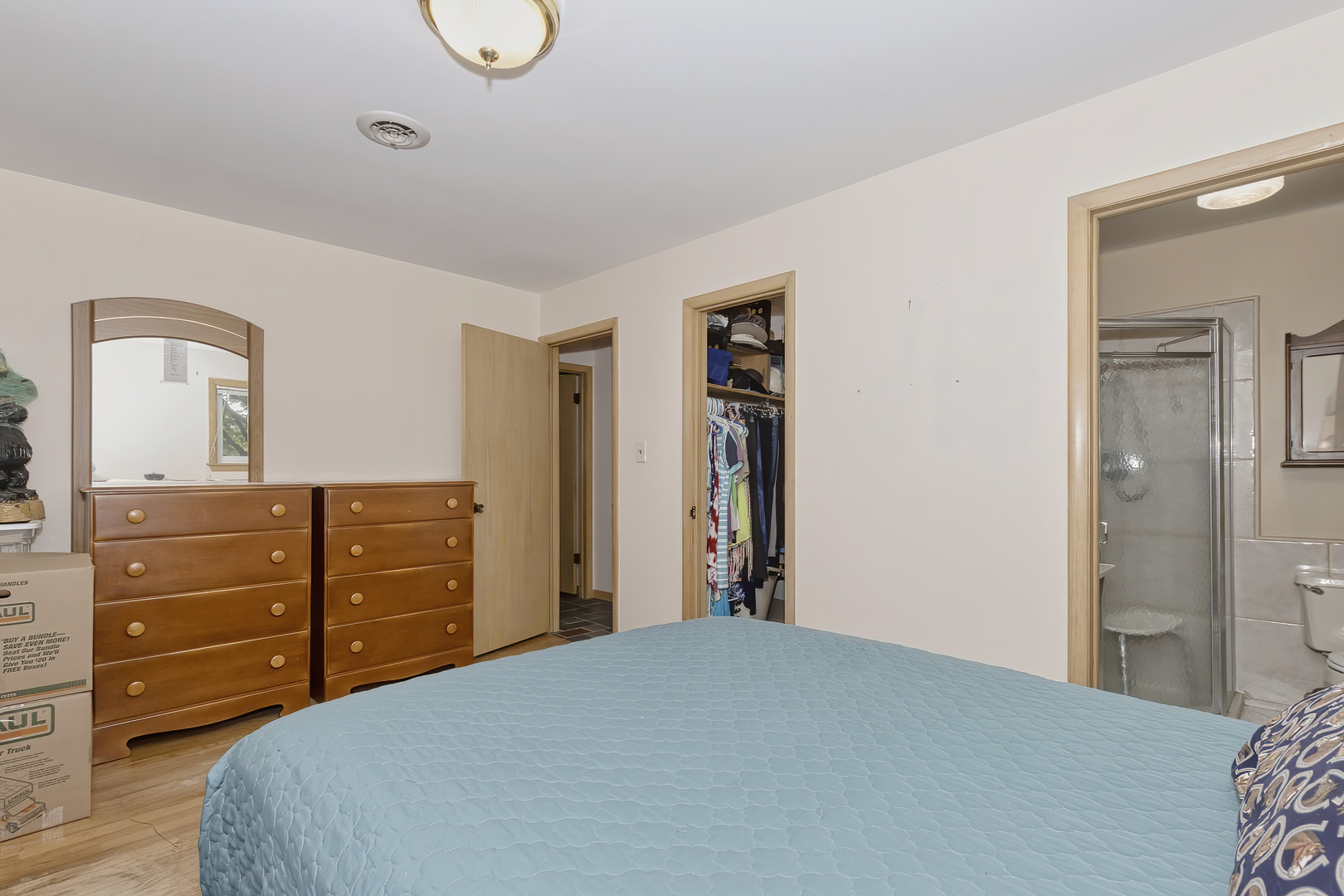 3511 West Gracy Road McHenry, IL 60050 - Photo 22 of 49 a bedroom with a bed and a dresser