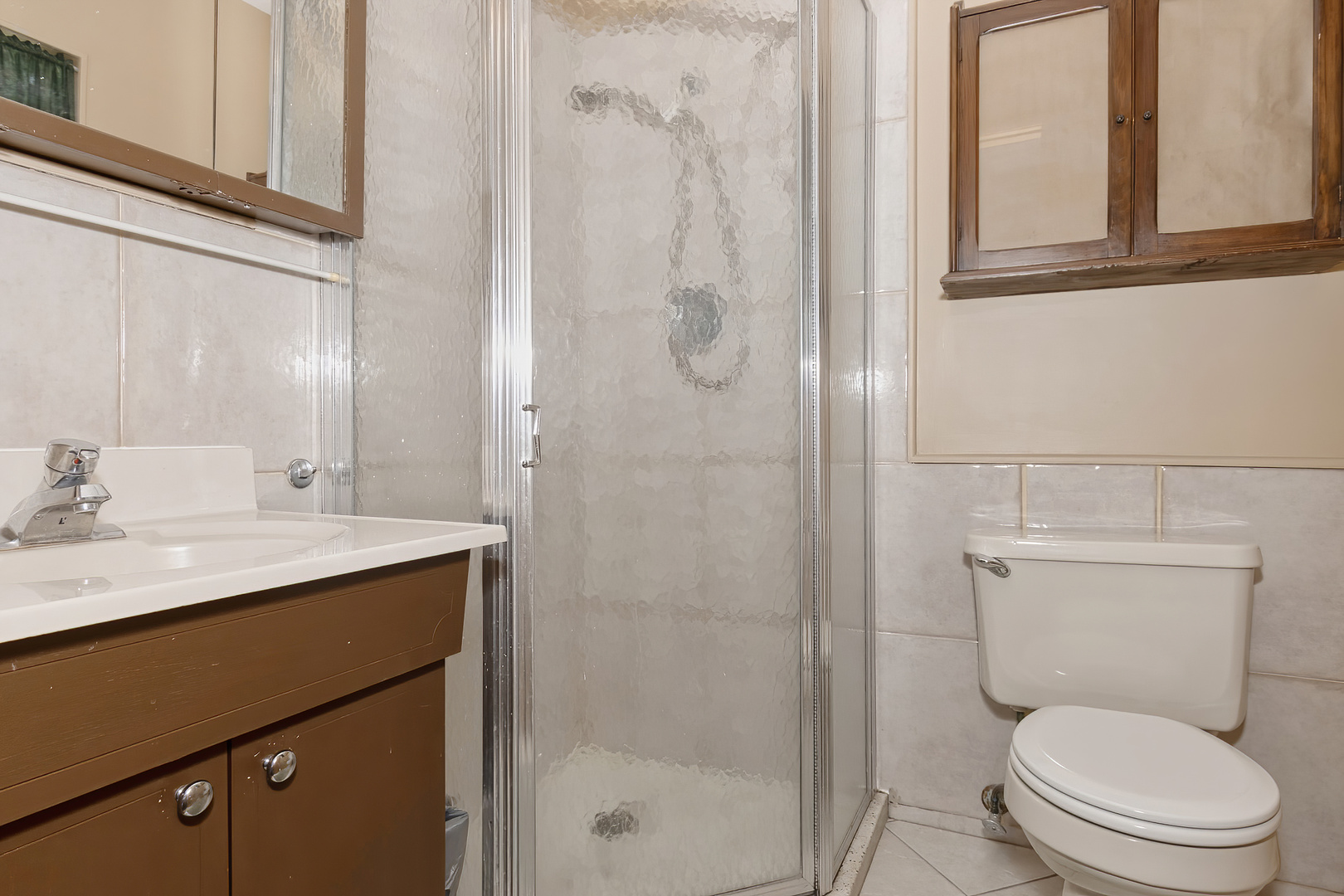 3511 West Gracy Road McHenry, IL 60050 - Photo 23 of 49 a bathroom with a toilet sink vanity and shower