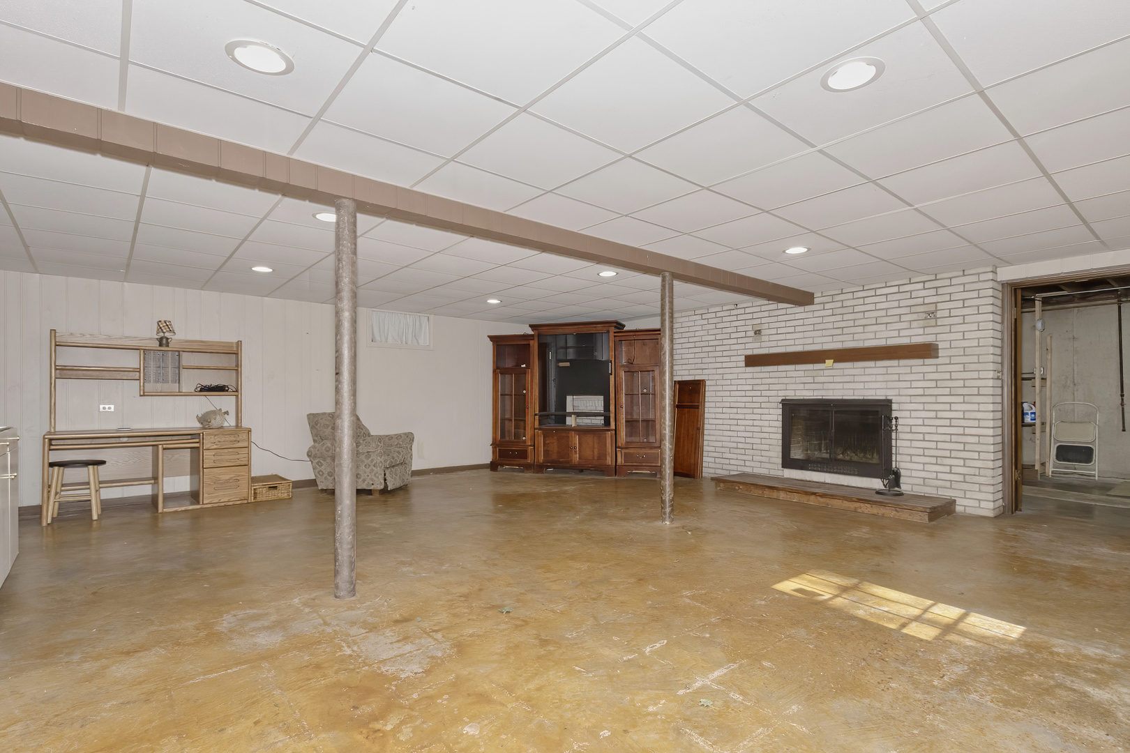 3511 West Gracy Road McHenry, IL 60050 - Photo 24 of 49 a view of an empty room with a fireplace
