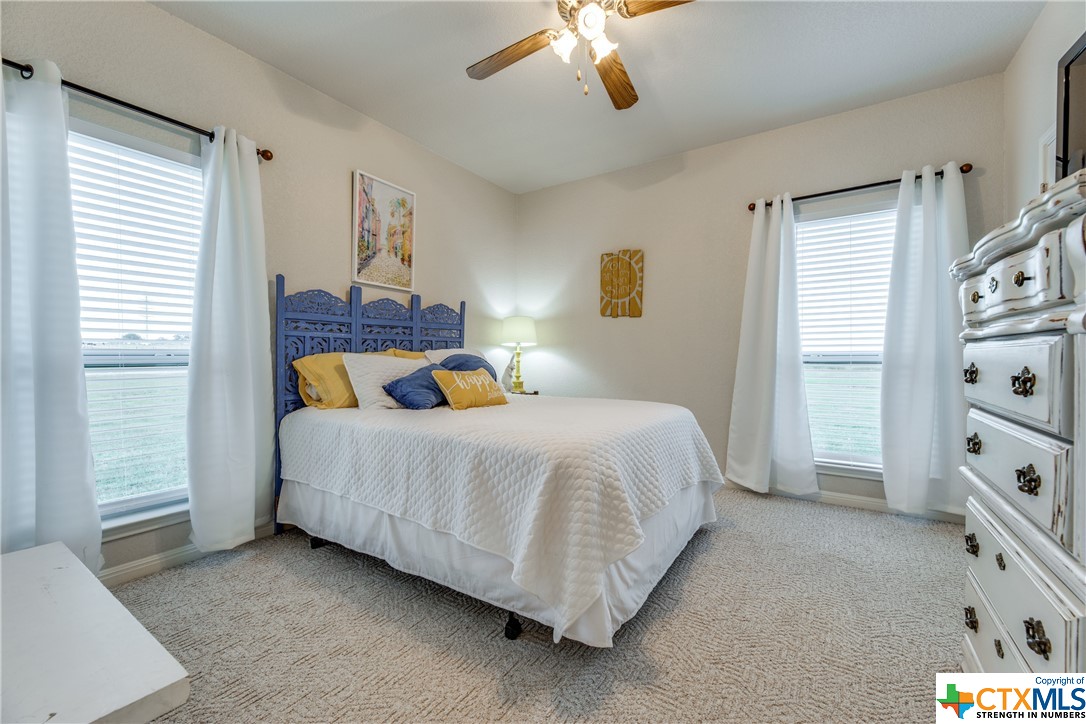 8177 Boenig Road Seguin, TX 78155 - Photo 12 of 21 a bedroom with a bed and a window