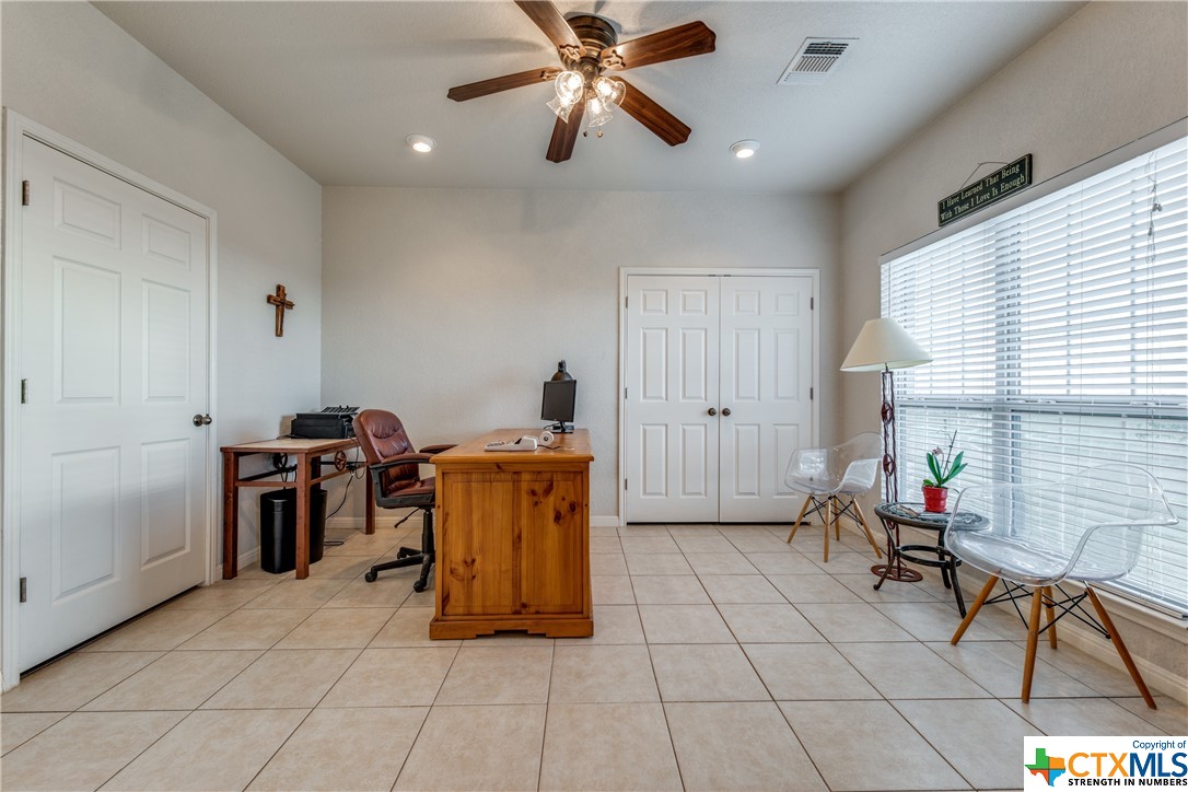 8177 Boenig Road Seguin, TX 78155 - Photo 9 of 21 a kitchen with stainless steel appliances granite countertop a stove a sink and a microwave