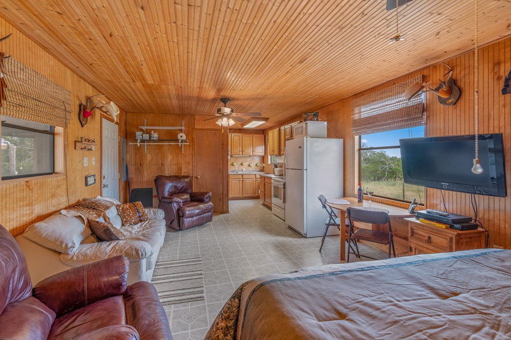 932 Shin Oak Road Menard, TX 76859 - Photo 7 of 23 a bedroom with furniture and a large window