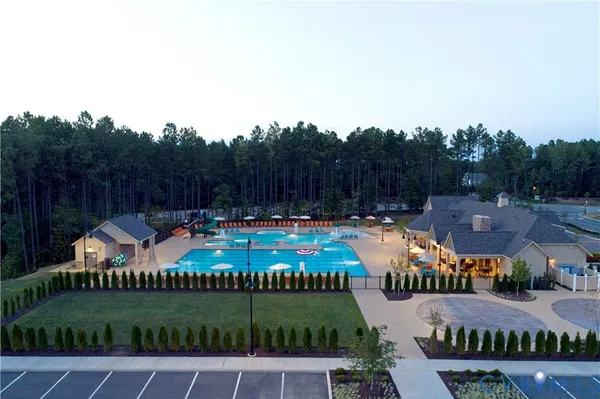 an aerial view of a house with swimming pool patio and mountain view