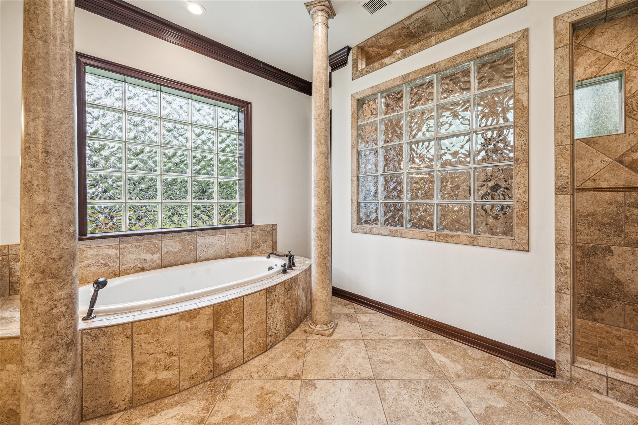12602 Overcup Drive Houston, TX 77024 - Photo 15 of 36 a bath tub sitting in front of a window