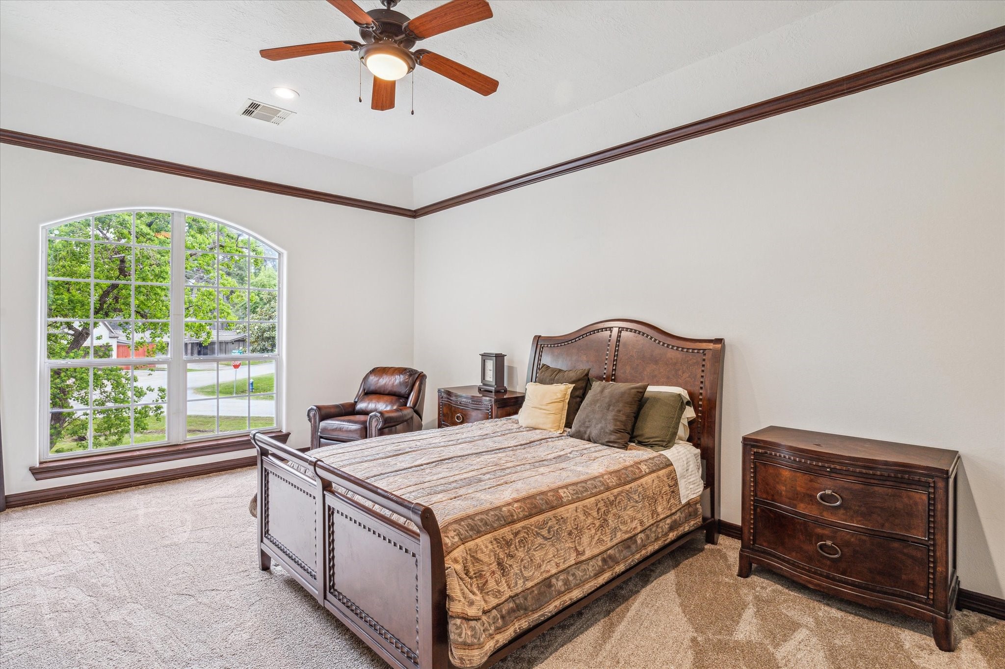 12602 Overcup Drive Houston, TX 77024 - Photo 26 of 36 a bedroom with a bed and a window