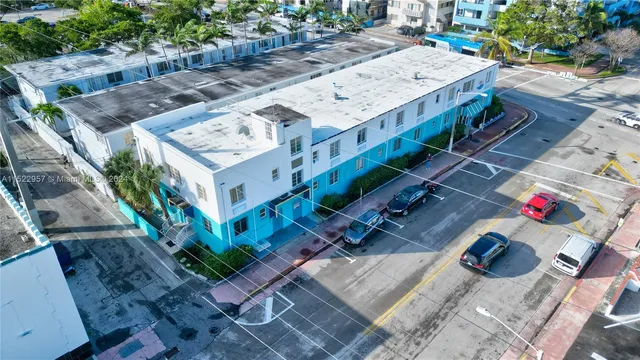 aerial view of a house with balcony and outdoor space