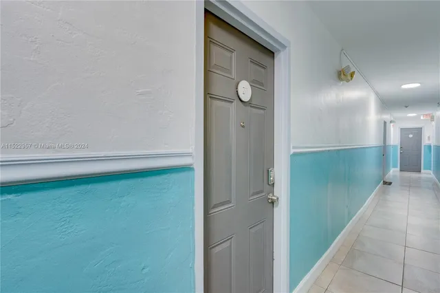 a bedroom with furniture and a large window