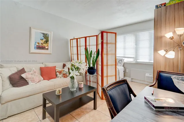 a bedroom with a bed and a lamp