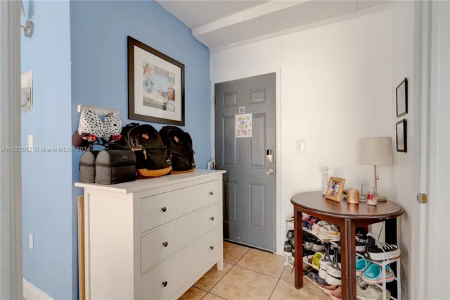 a view of bathroom with a toilet sink and mirror