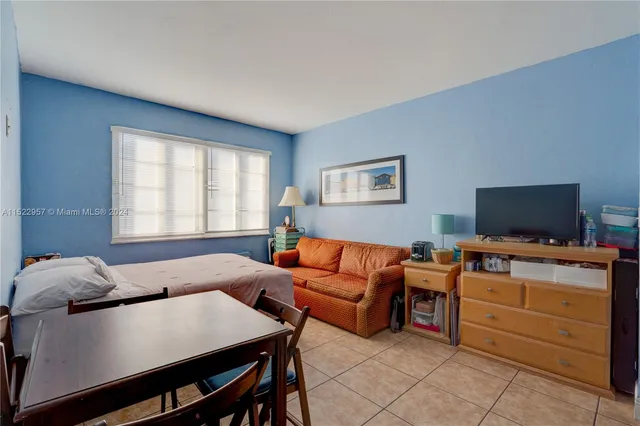a bathroom with a shower and a sink