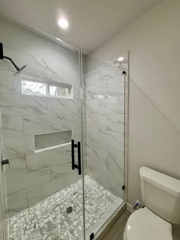 a bathroom with a sink and toilet