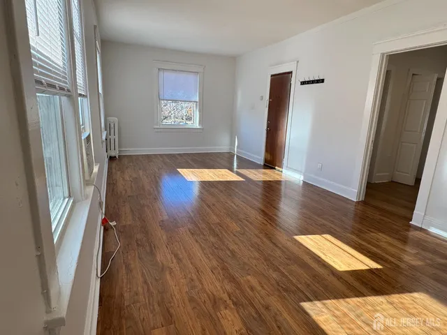 a view of entryway with wooden floor