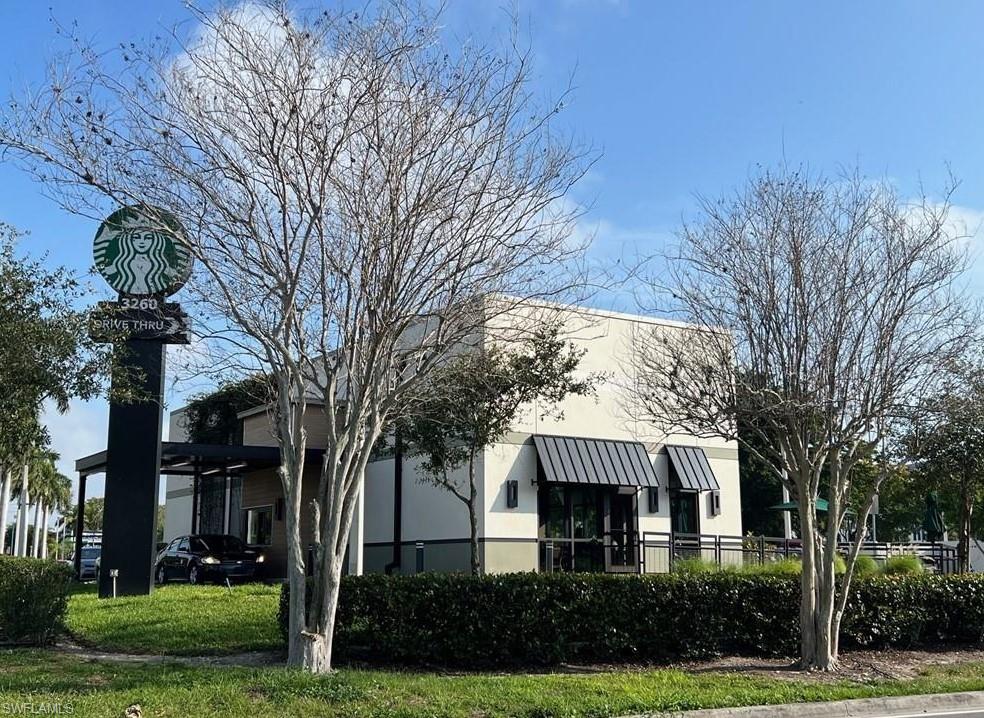 2964 Peters Avenue Naples, FL 34112 - Photo 12 of 12 a front view of a house with garden
