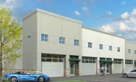 a view of a building with car parked