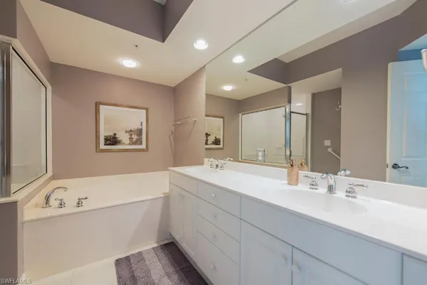 a bedroom with two beds and window