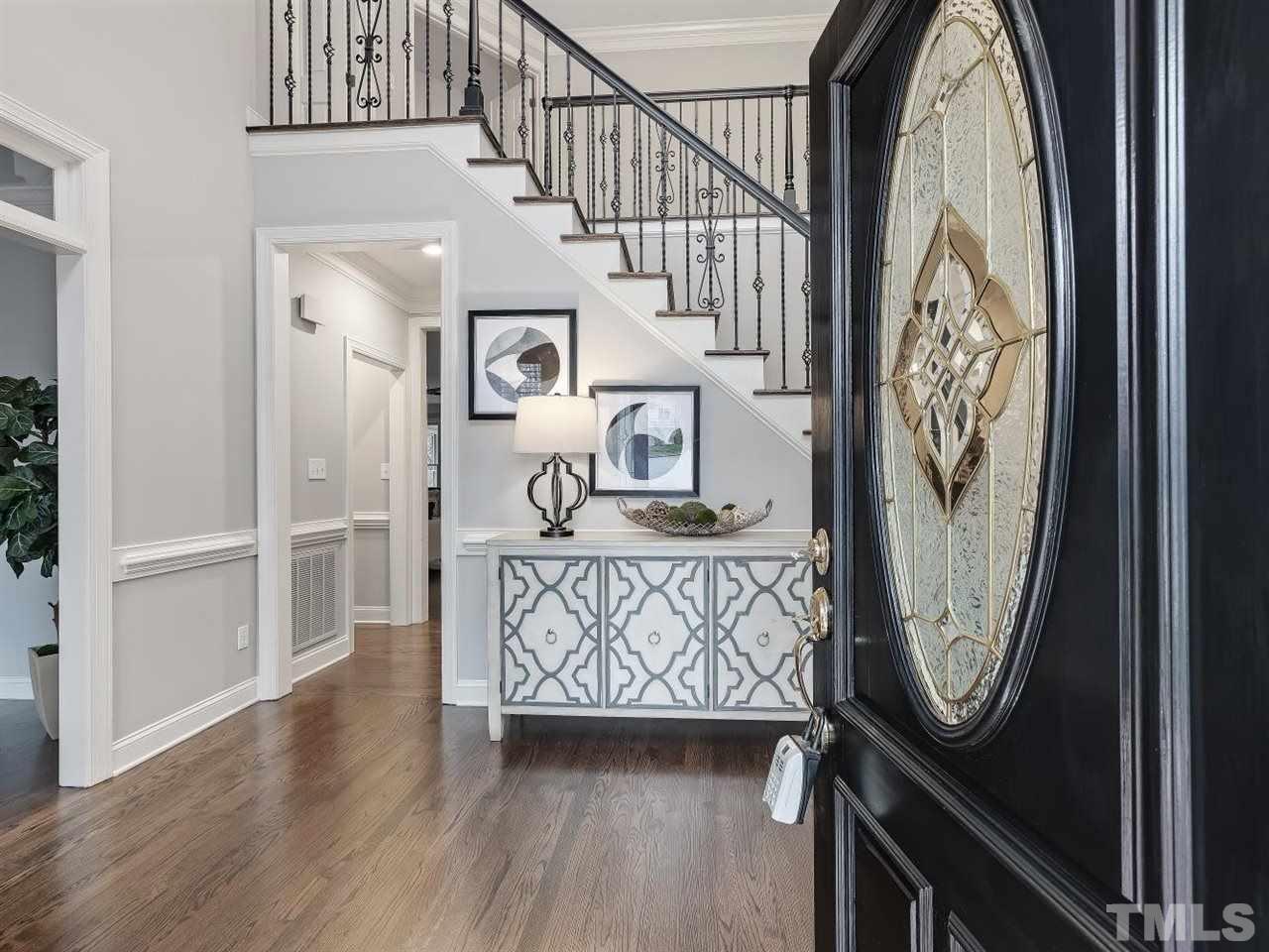 104 Beech Slope Way Cary, NC 27518 - Photo 2 of 30 a view of a hallway with wooden floor and entryway