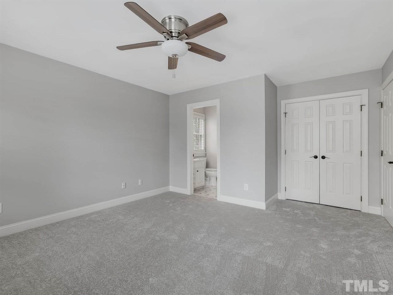 104 Beech Slope Way Cary, NC 27518 - Photo 18 of 30 a view of an empty room and a ceiling fan