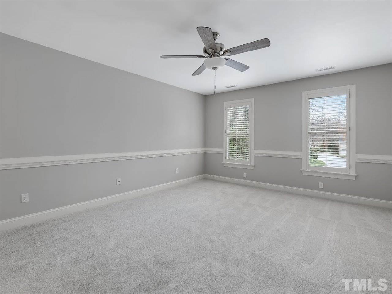 104 Beech Slope Way Cary, NC 27518 - Photo 20 of 30 an empty room with windows and fan