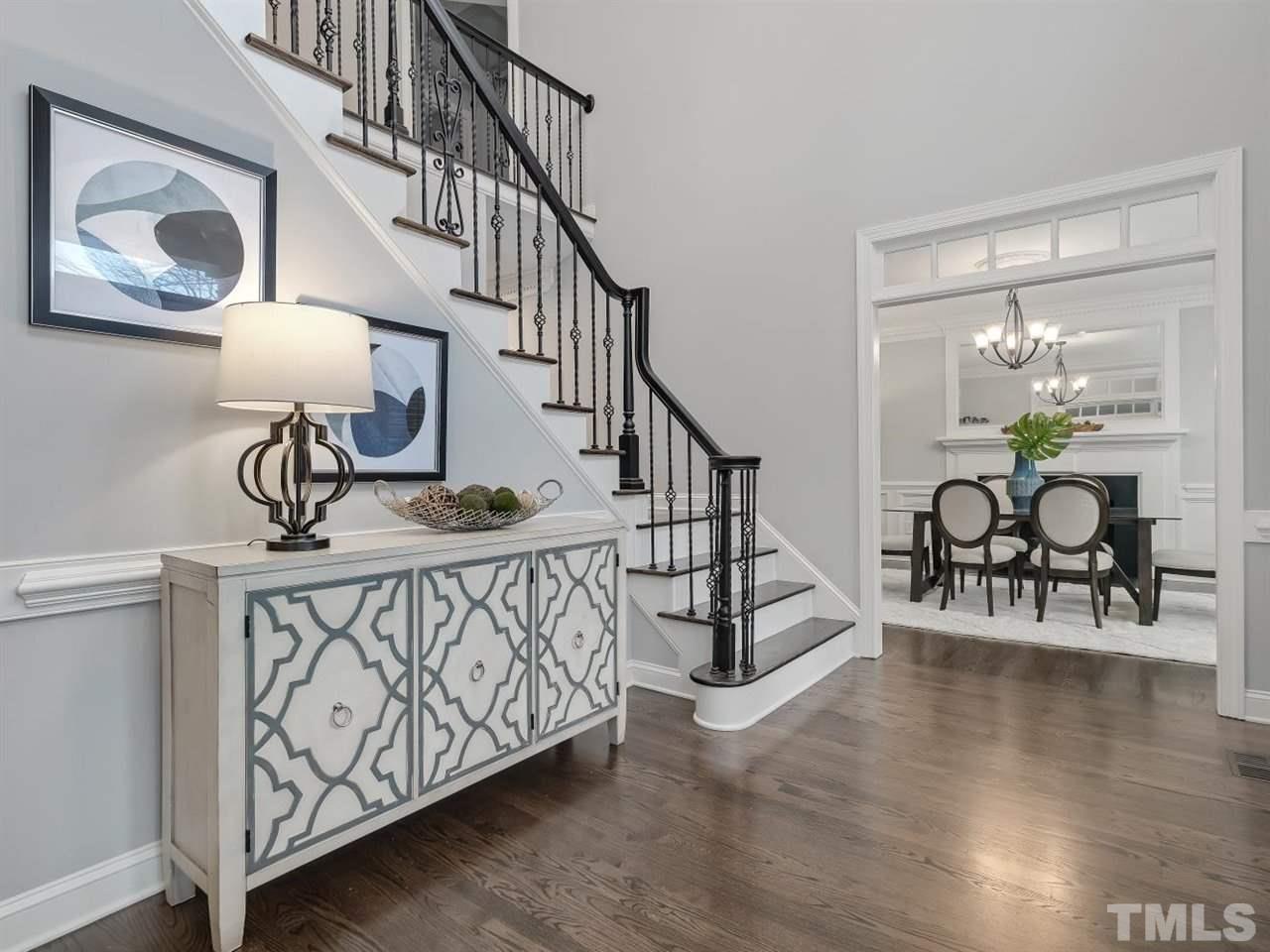 104 Beech Slope Way Cary, NC 27518 - Photo 3 of 30 a view of entryway dining room and hall with wooden floor