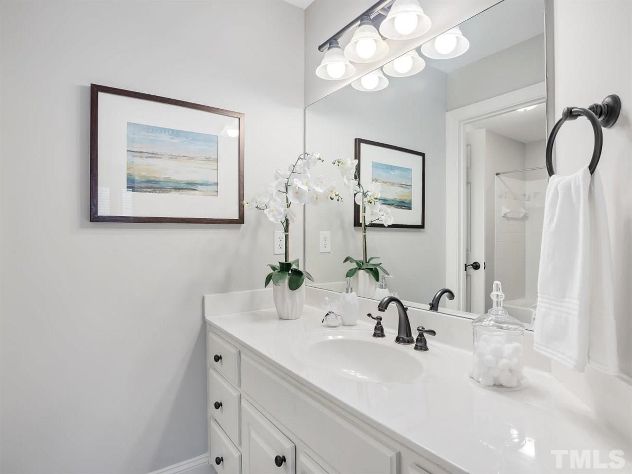 104 Beech Slope Way Cary, NC 27518 - Photo 21 of 30 a bathroom with a sink vanity and a mirror