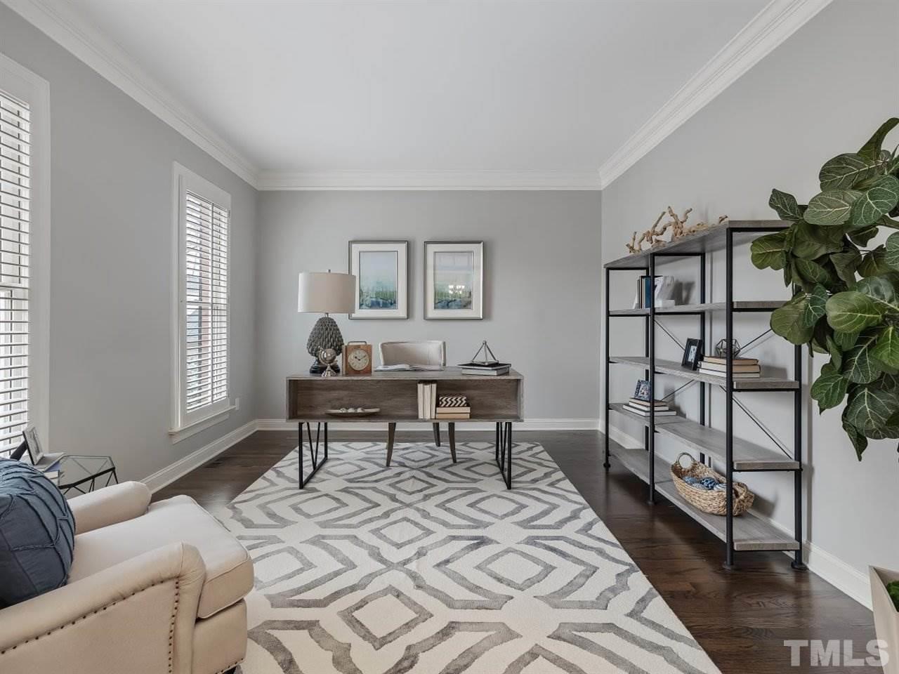 104 Beech Slope Way Cary, NC 27518 - Photo 5 of 30 a living room with furniture a rug and a window