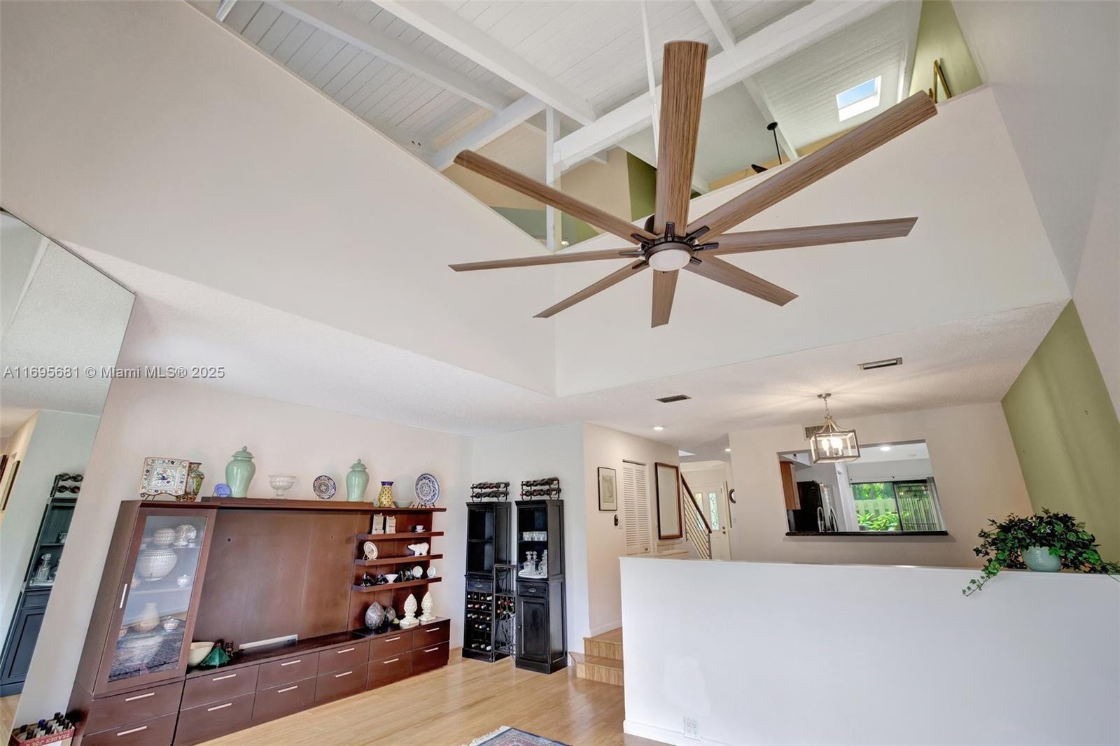 93 Northeast 17th Court, Unit 93 Fort Lauderdale, FL 33305 - Photo 13 of 43 a view of a living room and entryway with furniture