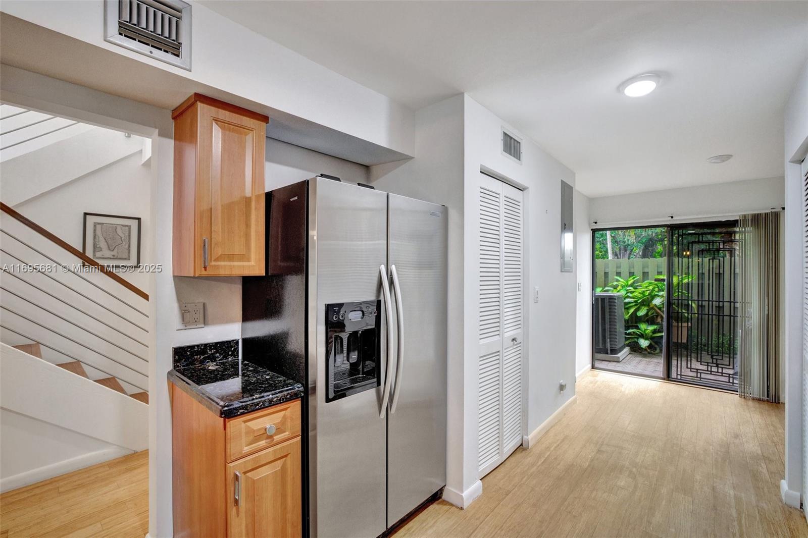 93 Northeast 17th Court, Unit 93 Fort Lauderdale, FL 33305 - Photo 24 of 43 a view of a kitchen with a refrigerator a sink and dishwasher