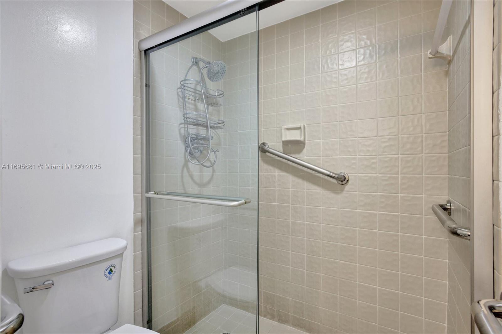 93 Northeast 17th Court, Unit 93 Fort Lauderdale, FL 33305 - Photo 38 of 43 a bathroom with a shower