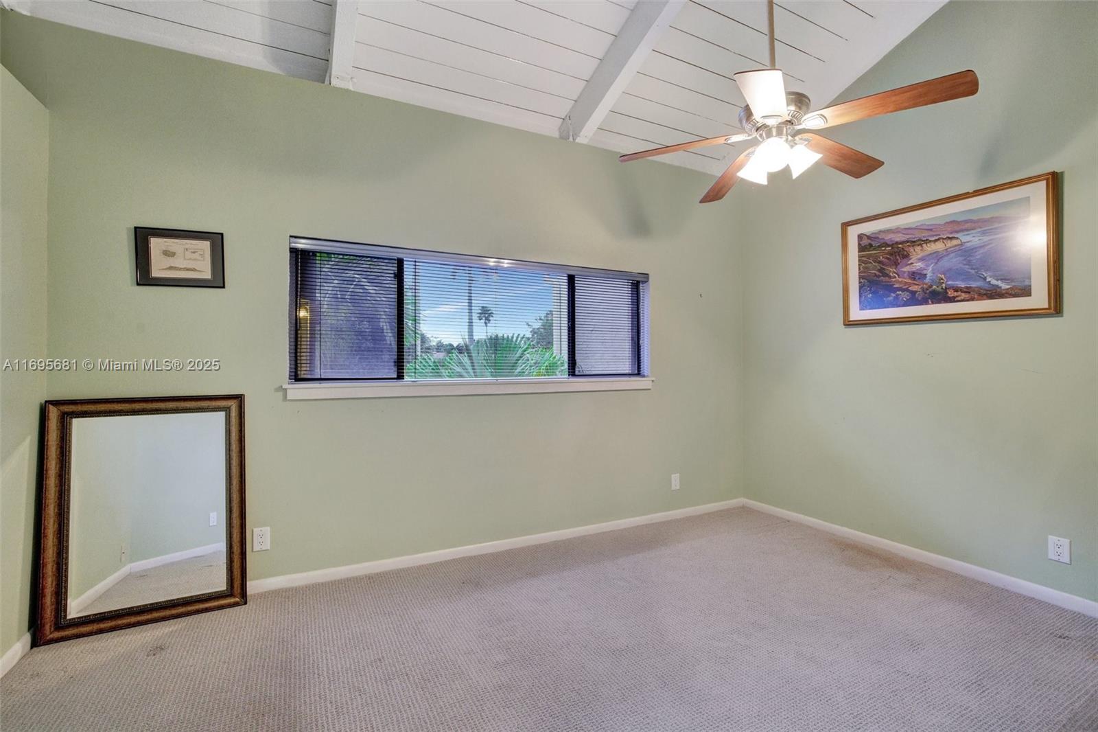 93 Northeast 17th Court, Unit 93 Fort Lauderdale, FL 33305 - Photo 39 of 43 an empty room with windows and fan