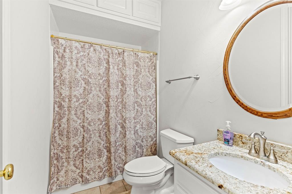 145 Indian Trail Decatur, TX 76234 - Photo 20 of 40 a bathroom with a sink and a mirror