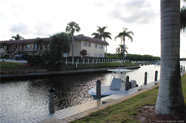 a view of a lake with a bench next to a lake