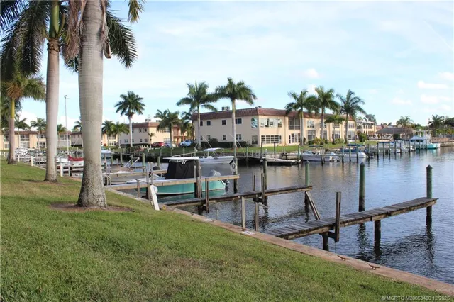a view of a lake with outdoor seating space
