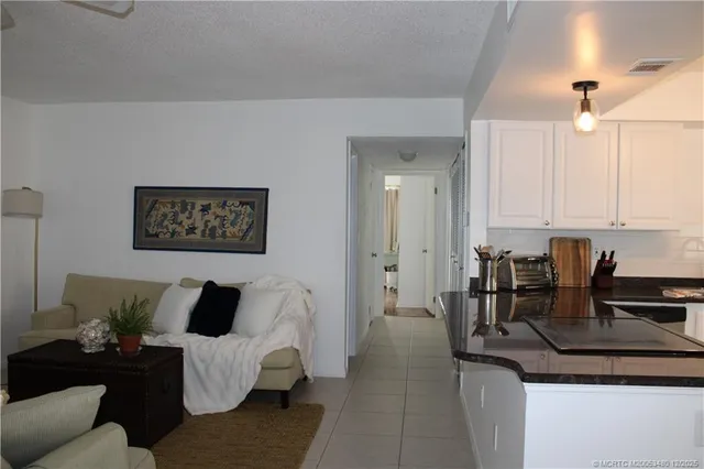 a living room with furniture and white walls