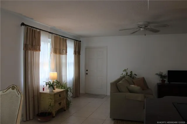 a living room with furniture and a gate