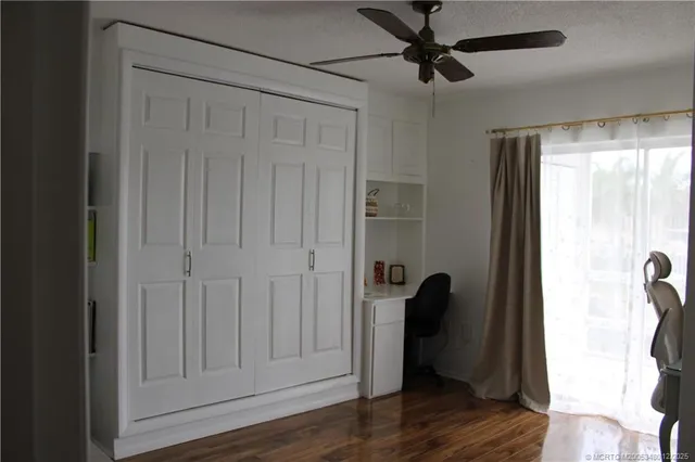 a view of a hallway and wooden floor