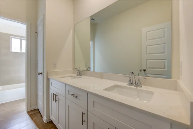 a bathroom with a sink and a mirror