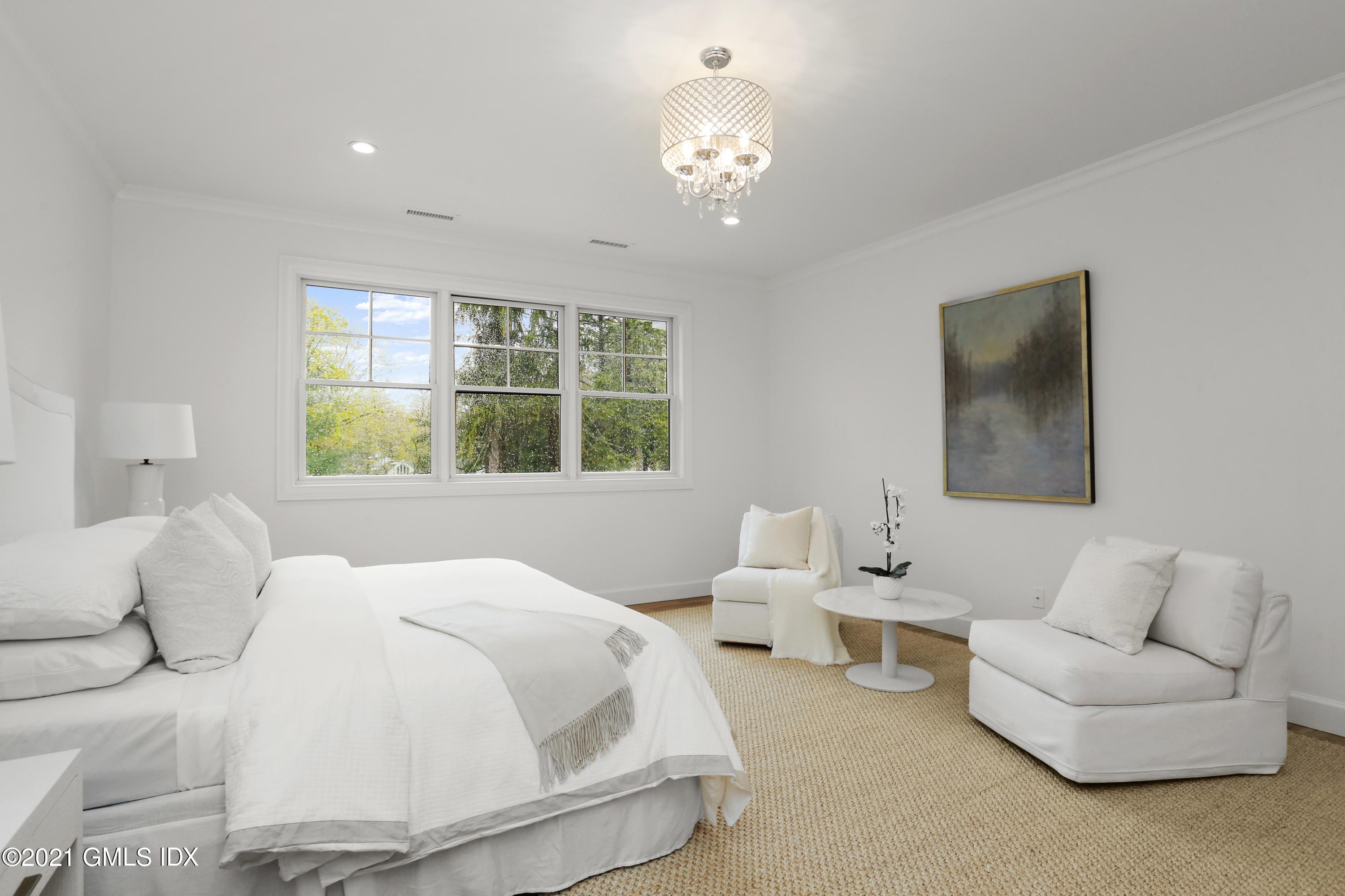 12 Cottontail Road Cos Cob, CT 06807 - Photo 15 of 35 a bedroom with a bed and a large window