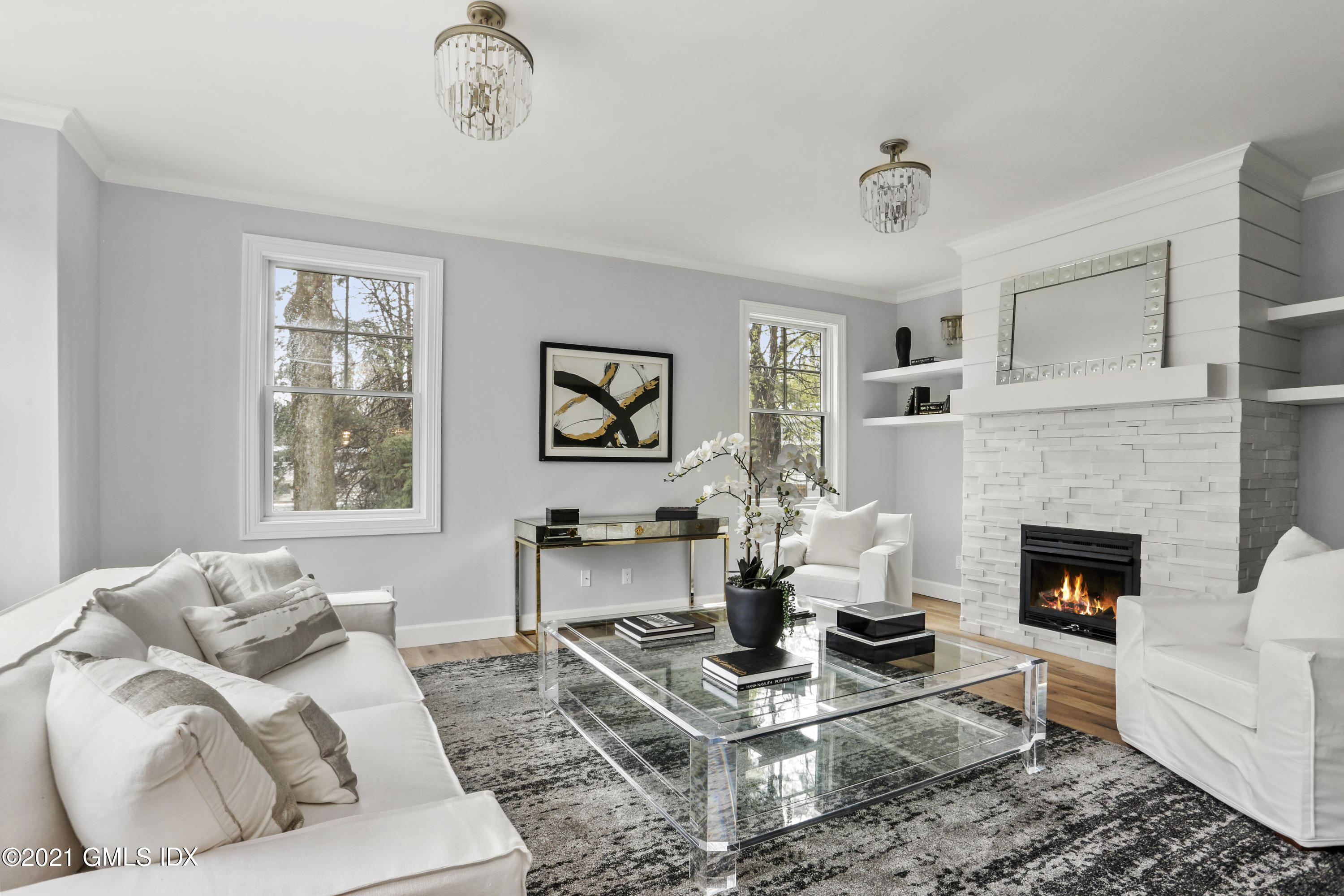 12 Cottontail Road Cos Cob, CT 06807 - Photo 2 of 35 a living room with furniture a rug and a fireplace