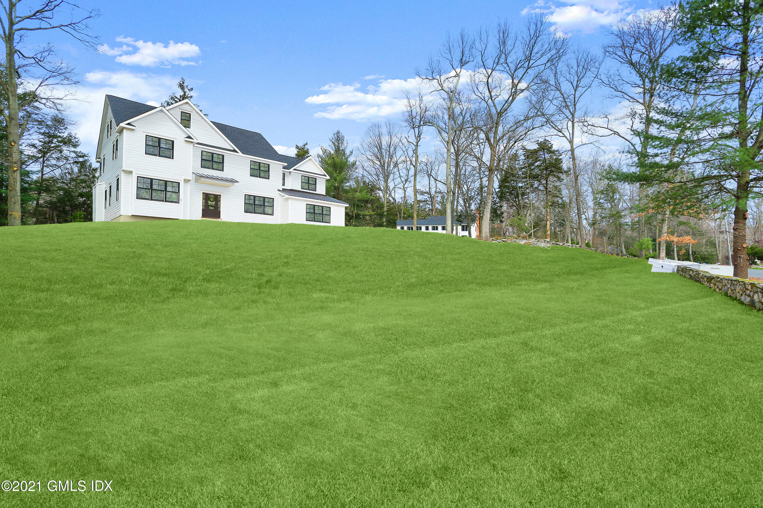 12 Cottontail Road Cos Cob, CT 06807 - Photo 27 of 35 a front view of a house with a garden
