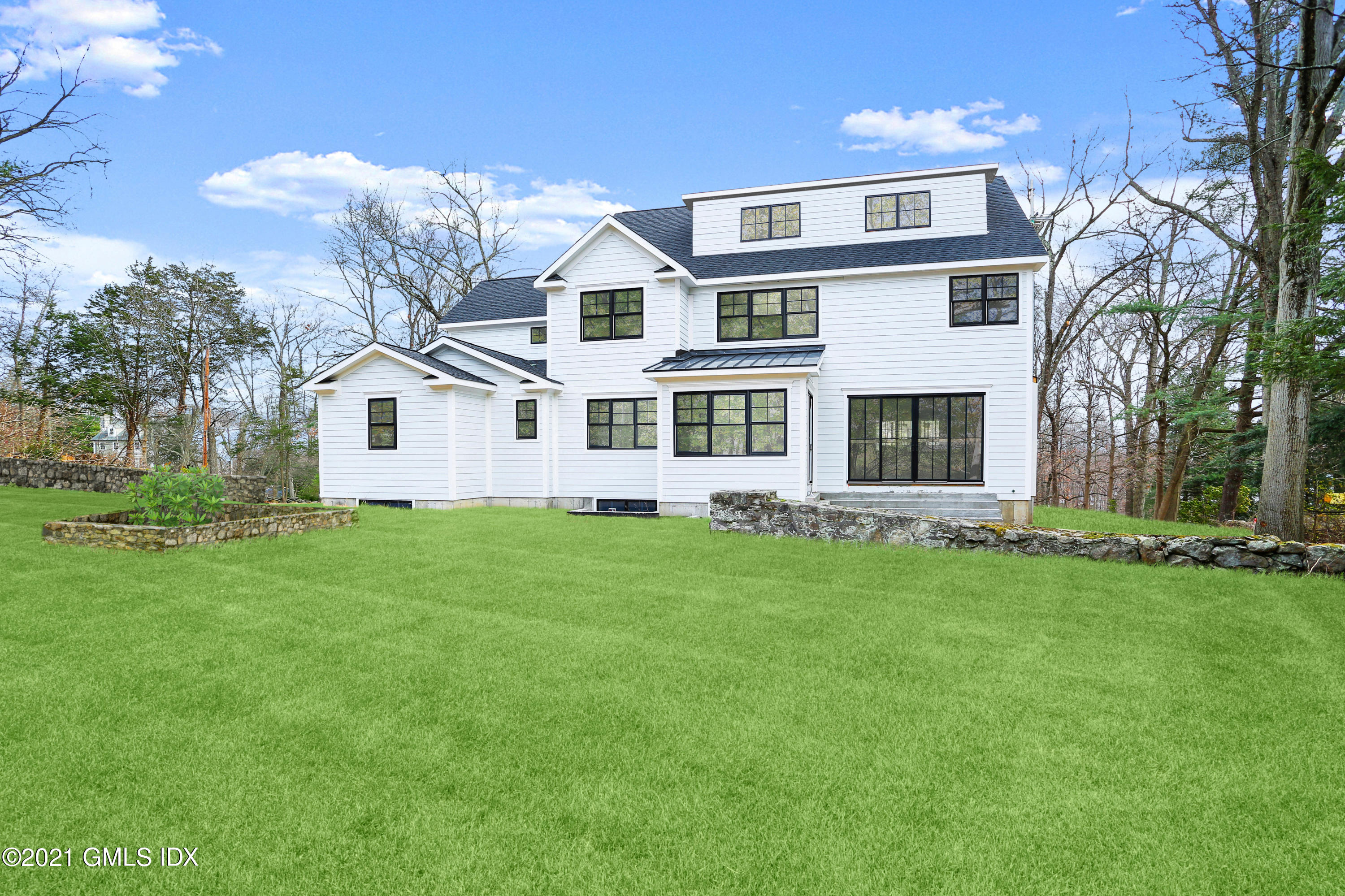 12 Cottontail Road Cos Cob, CT 06807 - Photo 29 of 35 a front view of a house with a garden