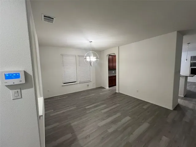 a view of a kitchen with a sink and cabinets