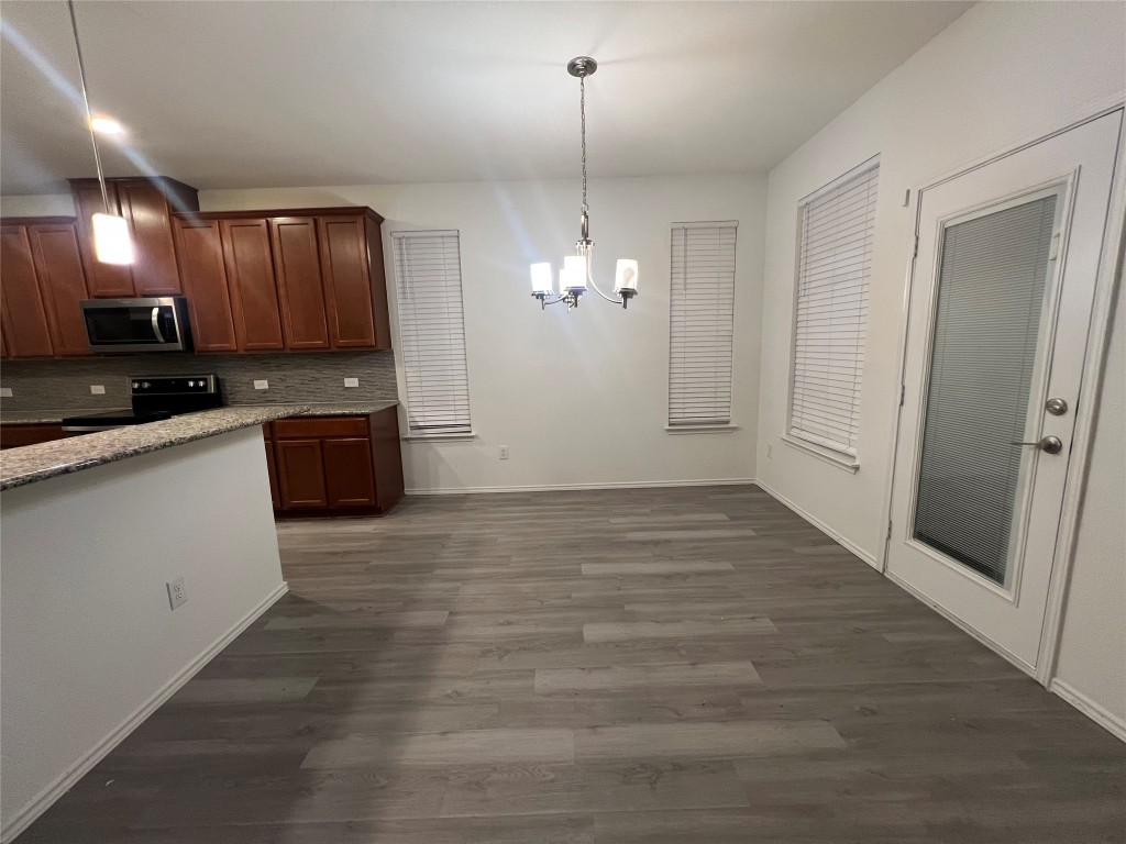 112 West Point Way Elgin, TX 78621 - Photo 8 of 9 a view of a kitchen with a sink and cabinets