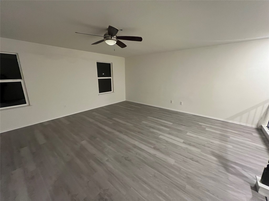112 West Point Way Elgin, TX 78621 - Photo 9 of 9 wooden floor in an empty room with a window