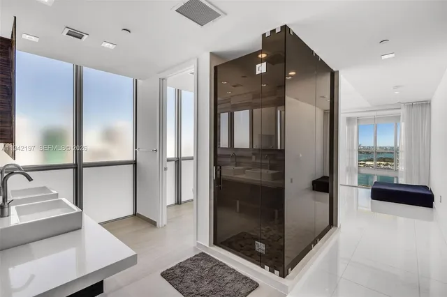 a bathroom with a tub and shower