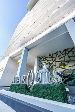 a front view of a house with plants