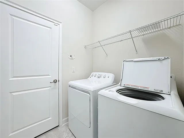 a utility room with dryer and washer