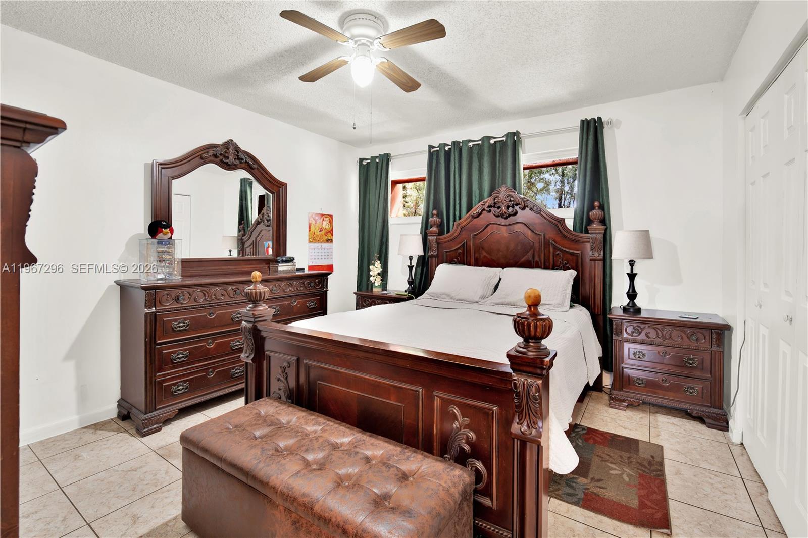 10881 Southwest 6th Street, Unit 7 Sweetwater, FL 33174 - Photo 15 of 34 a bedroom with a bed and furniture