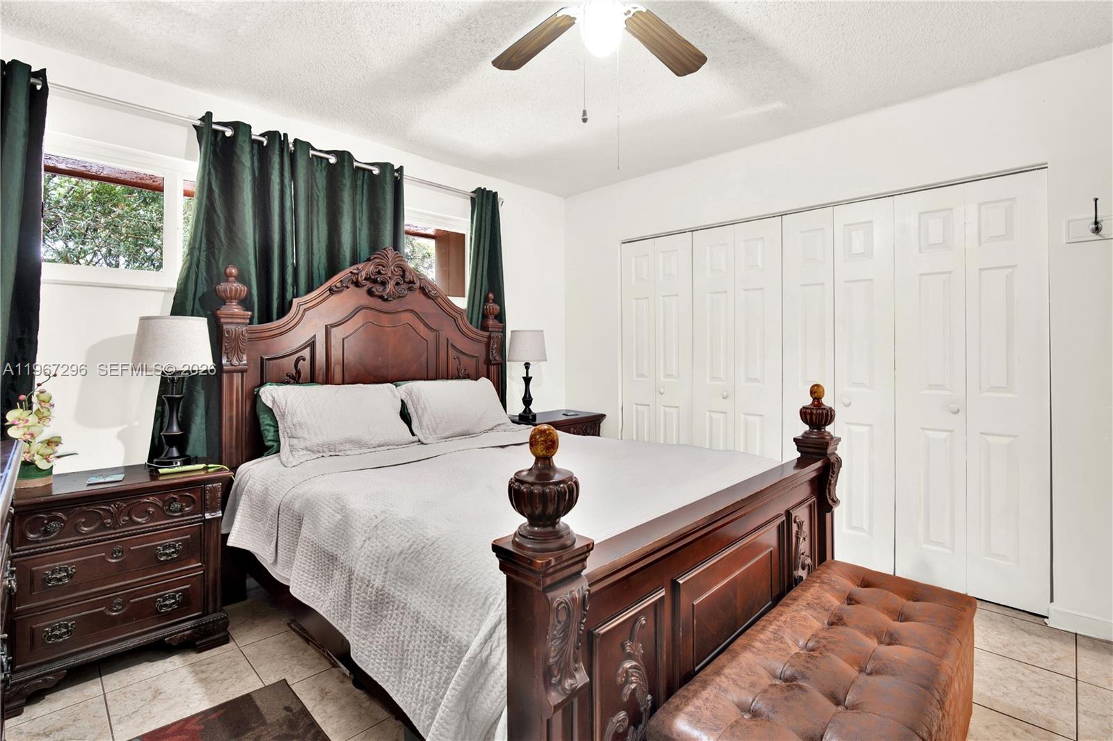 10881 Southwest 6th Street, Unit 7 Sweetwater, FL 33174 - Photo 16 of 34 a bedroom with a bed and a dresser