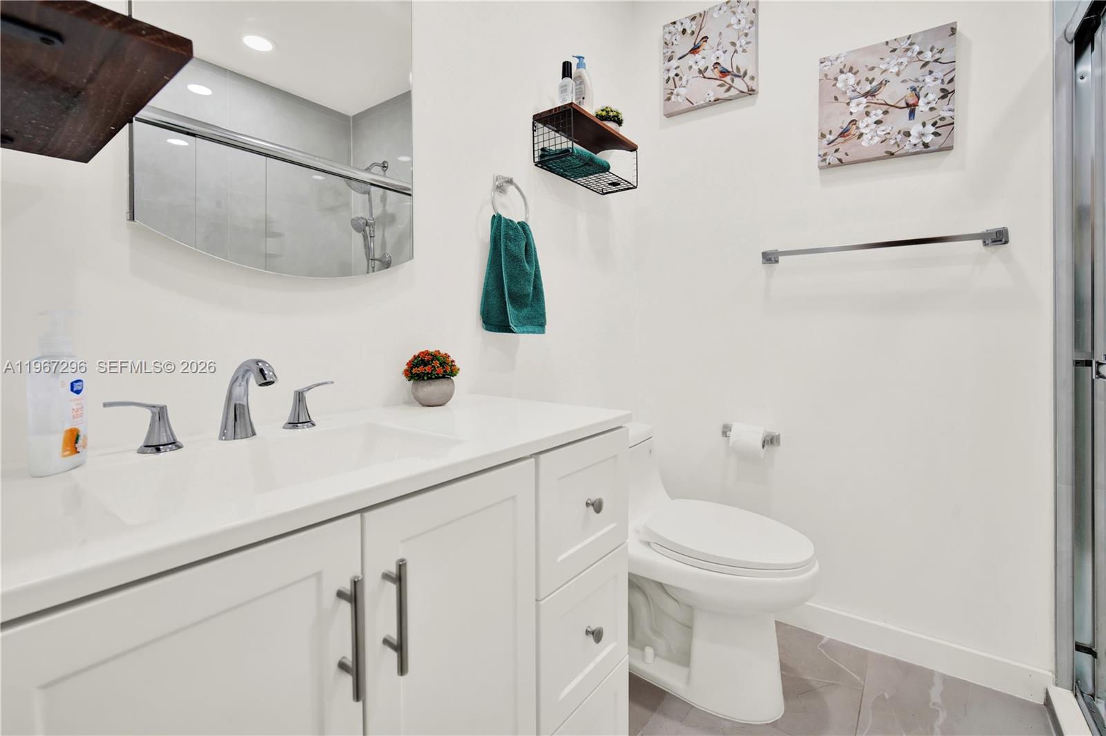 10881 Southwest 6th Street, Unit 7 Sweetwater, FL 33174 - Photo 19 of 34 a bathroom with a sink and a toilet