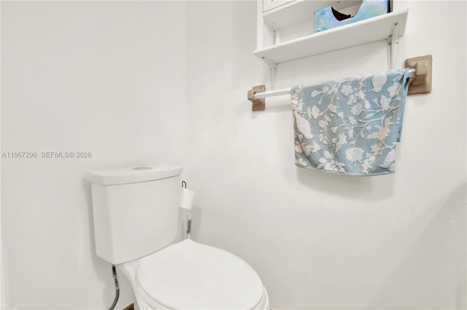 10881 Southwest 6th Street, Unit 7 Sweetwater, FL 33174 - Photo 22 of 34 a white toilet sitting next to a white wall